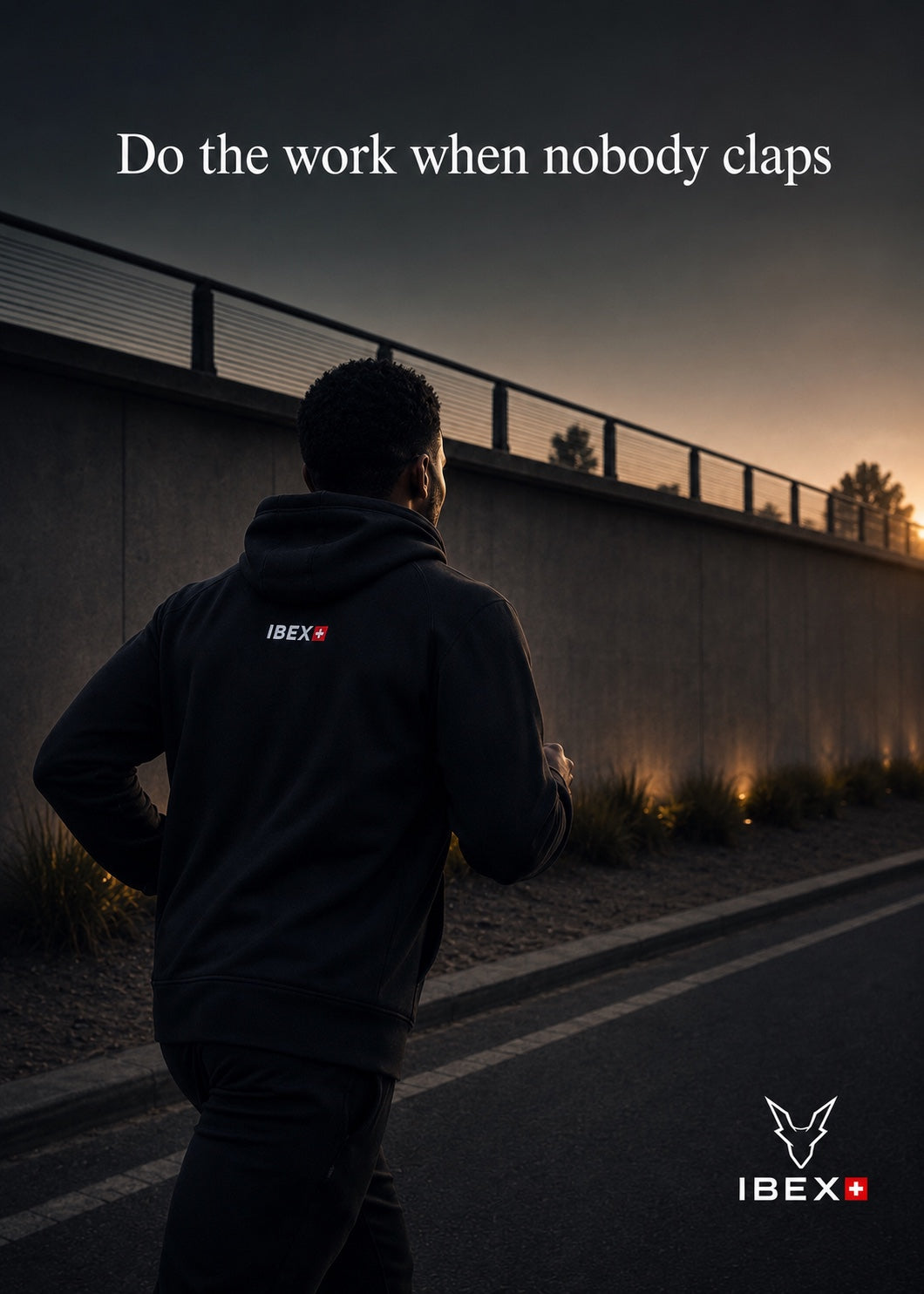 IBEX model running in a black hoodie at dusk