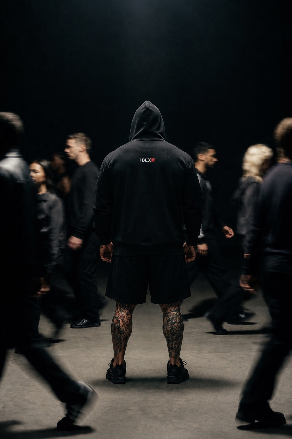 IBEX model wearing black hoodie from the back in motion scene
